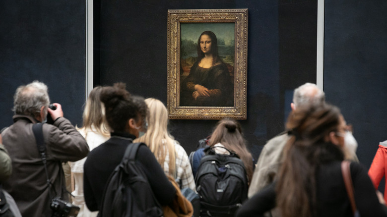 Visitors admiring the Mona Lisa