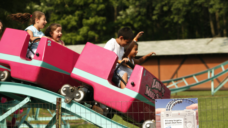 Children on roller coaster at Land of Make Believe
