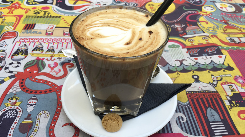 Coffee latte on a colorful placemat in a shop in Helsinki