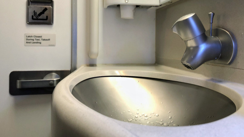 An airplane bathroom sink