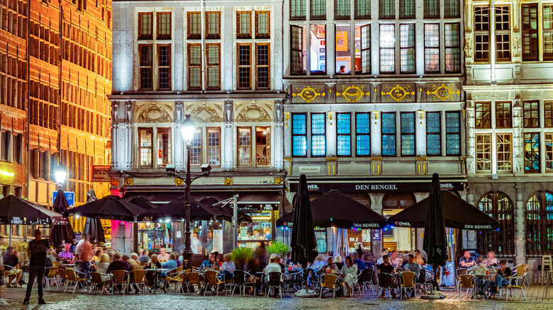 Streetside eateries among historic buildings in central Antwerp