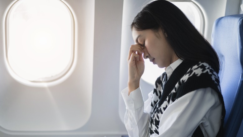 Stressed passenger inside a plane
