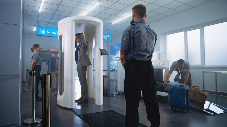 Man walks through airport security