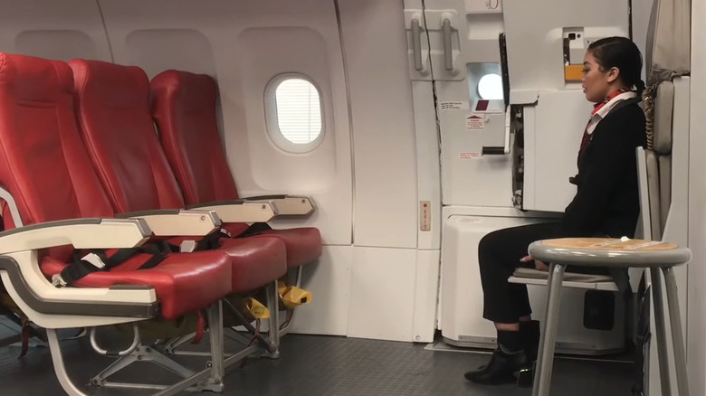 flight attendant jump seat drill