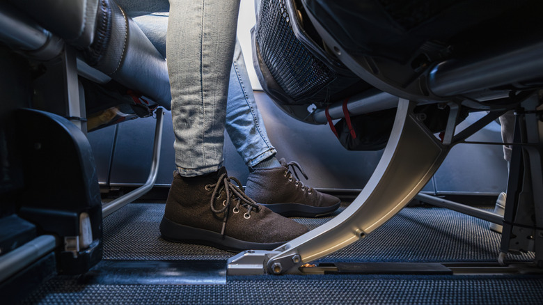 A pair of feet can wearing comfortable lace-up shoes