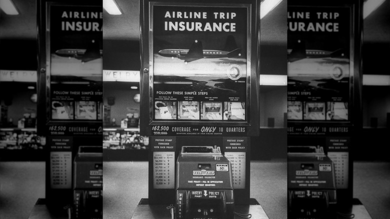 Black and white vintage airport life insurance vending machine