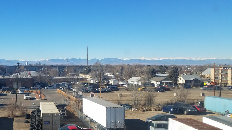 Aerial view of Northwest Aurora, Colorado with mountains in background and clear sky