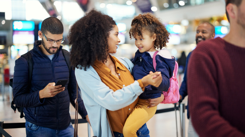 Mom and child in the TSA security checkpoint line