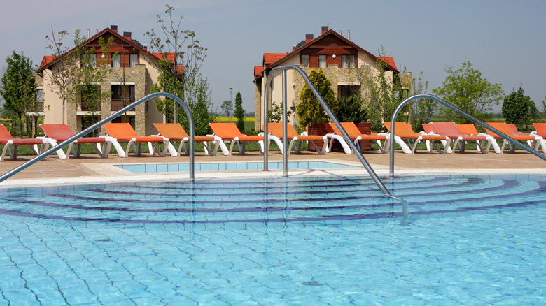 Outdoor thermal bath and spa in Buk, Hungary, surrounded by chairs