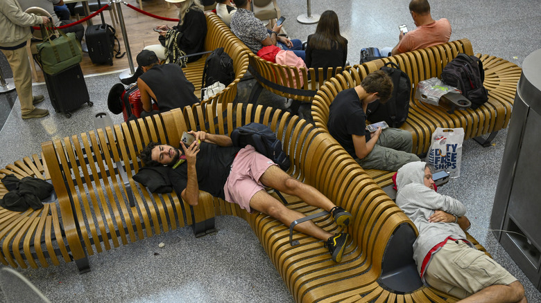 Travelers wait for their flights a Humberto Delgado International Airport in Lisbon, Portugal
