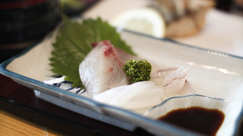 Close-up of sashimi on a plate in Ine