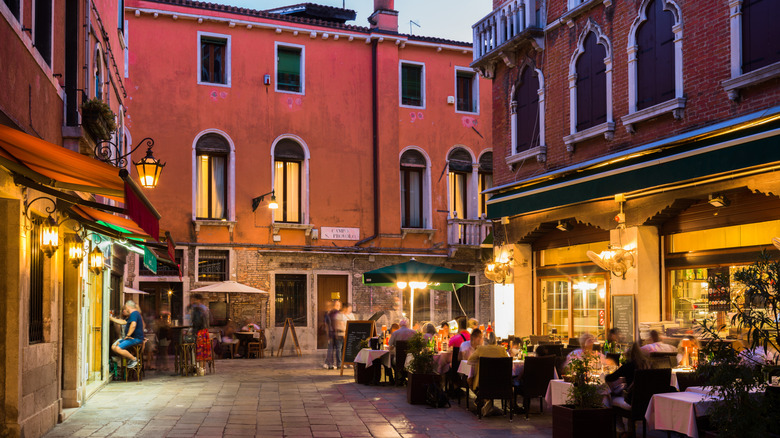 Terrace diners in the evening in Venice, Italy