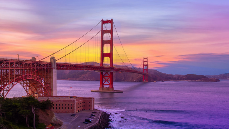 The Golden Gate bridge at sunset with Fort Point National Historic Site at its base