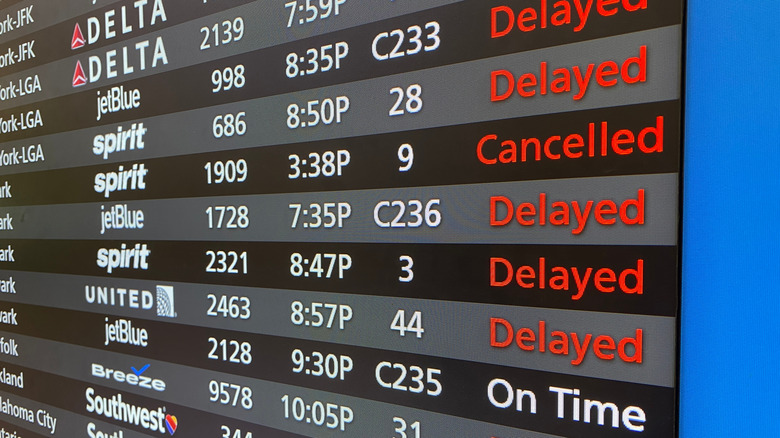 flight board with canceled and delayed flights