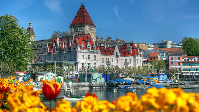 Castle Chateau d'Ouchy in Lausanne, Switzerland, with orange tulips