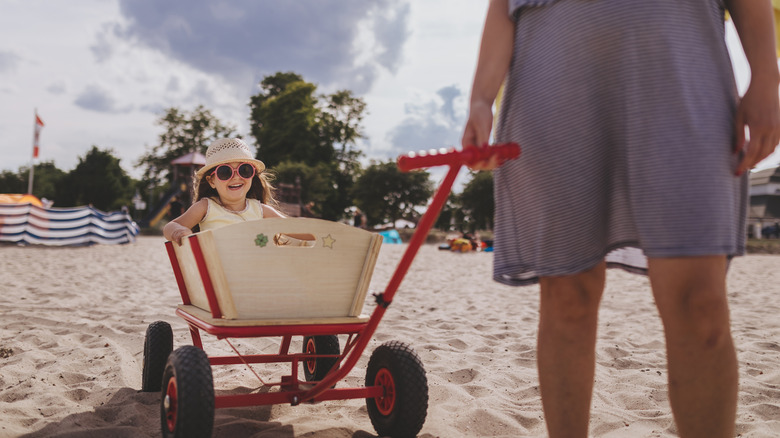 Child in beach cart
