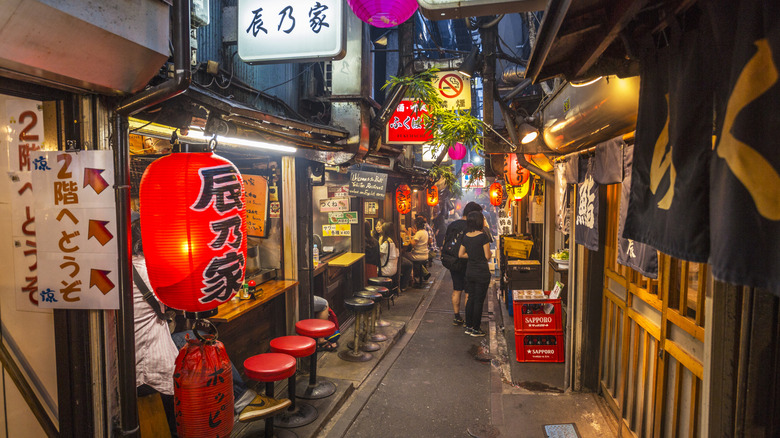 Tokyo's Omoide Yokocho, with illuminated signs at night