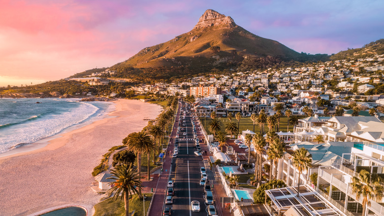 sunset view of the beach in Cape Town with Lion head mountain in the background