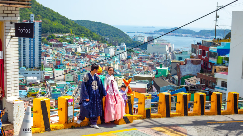 Traditional couple holding hands in Busan