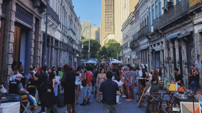 View of shoppers at a street market on Rua do Senado