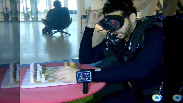 Diver and chess board inside Deep Dive Dubai