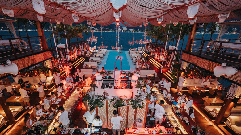 Staff preparing for a special event at Yona Beach Club, floating in the Andaman Sea off of Phuket, Thailand