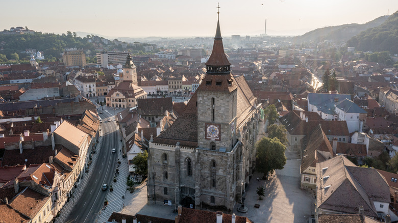 A street with a historical church in Transylvania, Romania