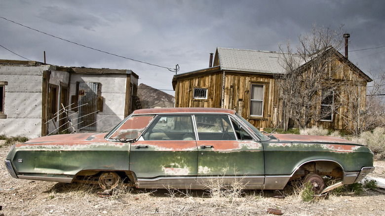 Battered car amidst Goldfield ruins