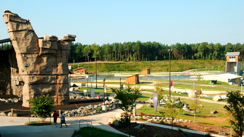 Complex with outdoor climbing wall, sidewalks, and river