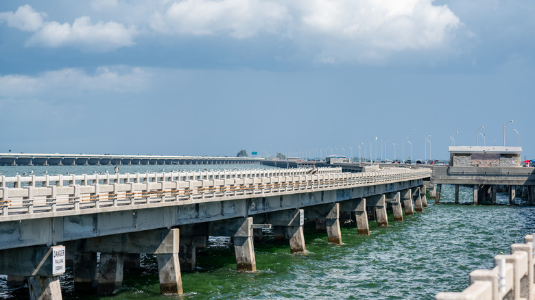 fishing pier and bridge extending into water
