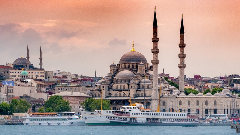 Sunset image of the famous waterfront in Istanbul, Turkey, with its mosques visible in the background