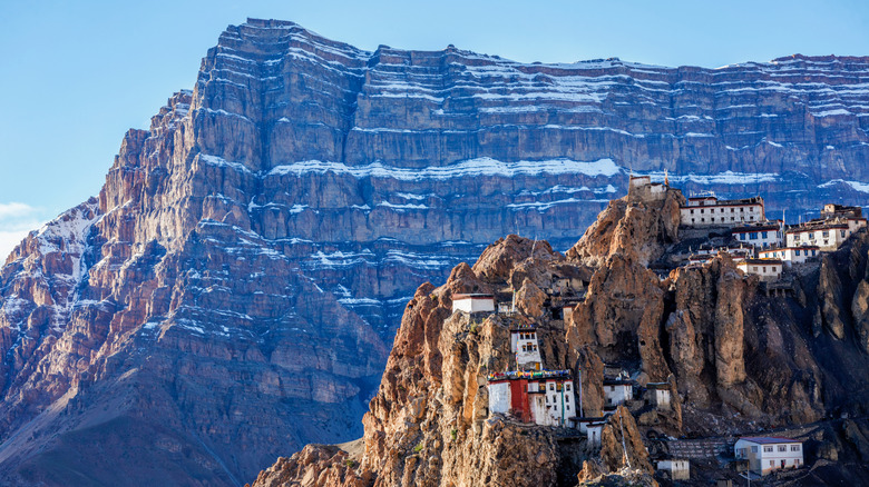A monastery wedged into the treacherous rocky walls of the Himalayas