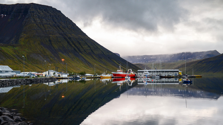 Dramatic clouds over the port of Ísafjörður and its surrounding mountains in Westfjords, Iceland.