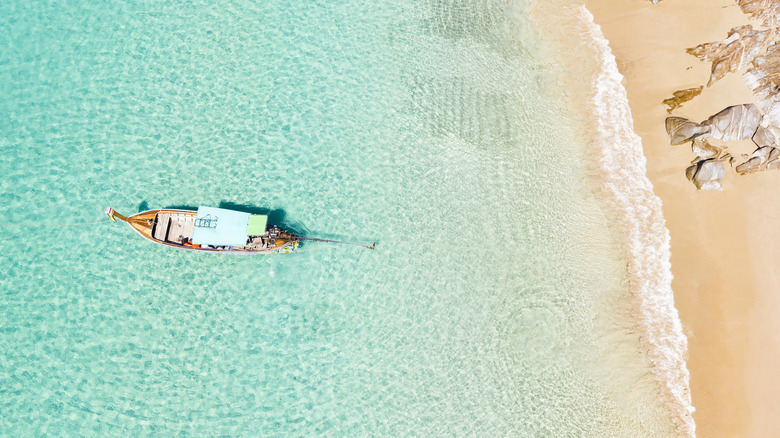View from above, stunning aerial view of an empty beautiful tropical beach.