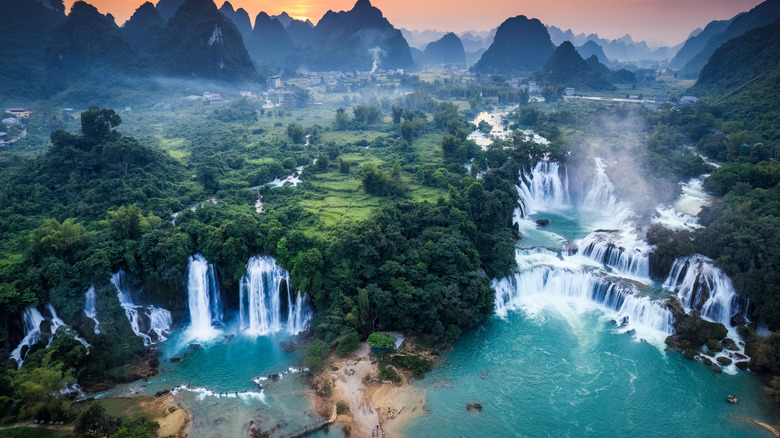 Ban Gioc Waterfalls and mountains at sunset