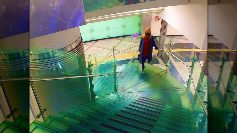 Woman on stairs at Noksapyeong Station, Seoul.