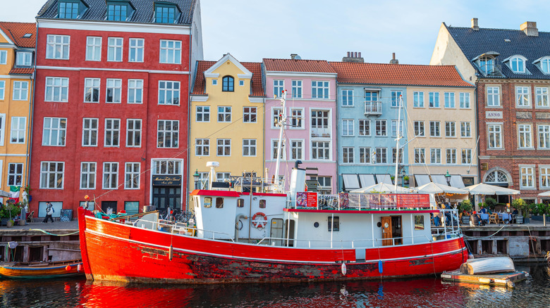 Nyhavn Copenhagen canal houses behind a boat on the harbor