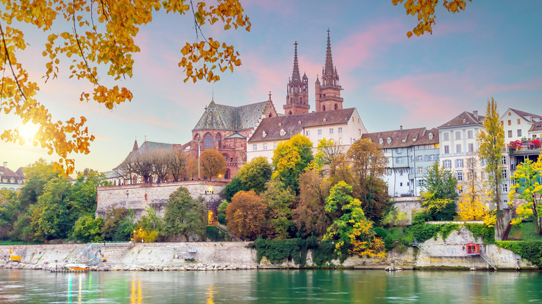 Image of the Old Town of Basel, Switzerland, located along the Rhine River in Europe and pictured at sunset