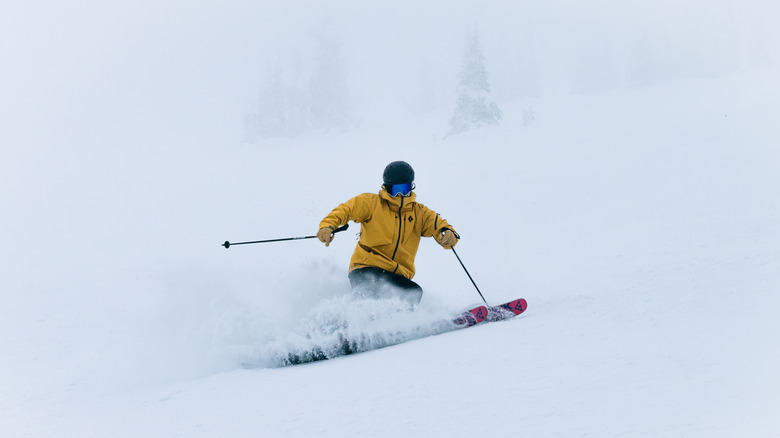 A skier skiing down a mountain