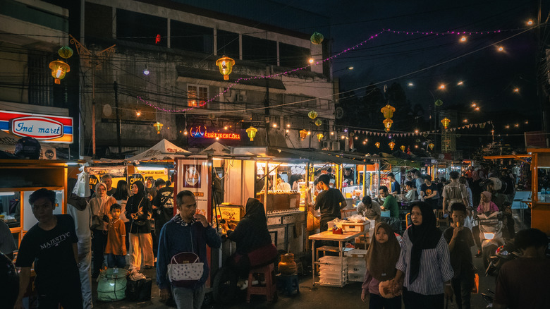 People at a night market in Jakarta, Indonesia