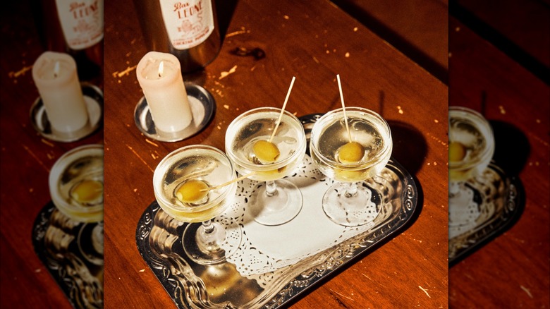 Close-up of three Filthy Martinis on a table at Bar Leone.