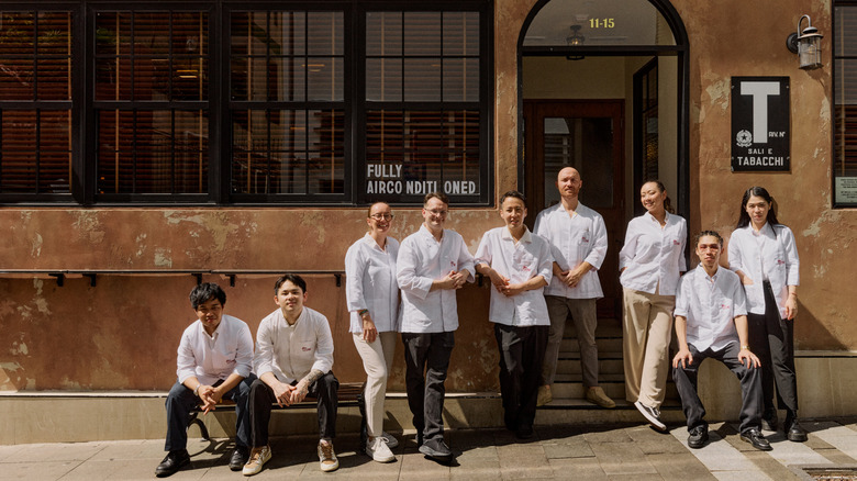 Lorenzo Antinori with his staff outside Bar Leone in white jackets.