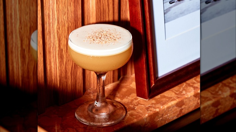 Close-up of the Olive Oil Sour on a shelf at Bar Leone.