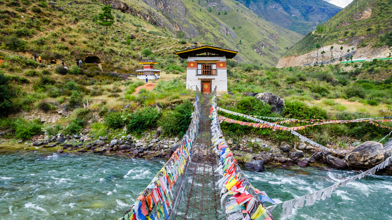 Flags on the bridge at the Paro River in Bhutan