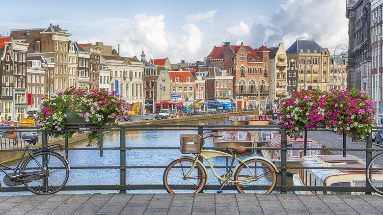 A bicycle parked by a canal in Amsterdam, the Netherlands