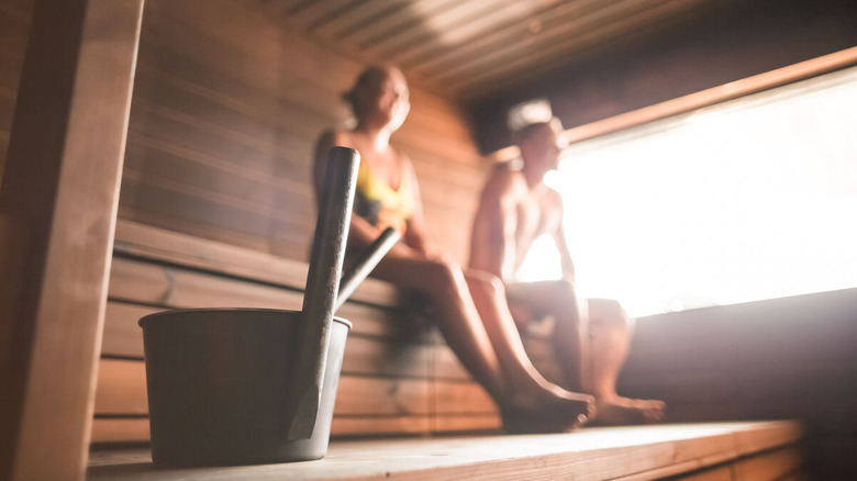 Two people in a Finnish sauna