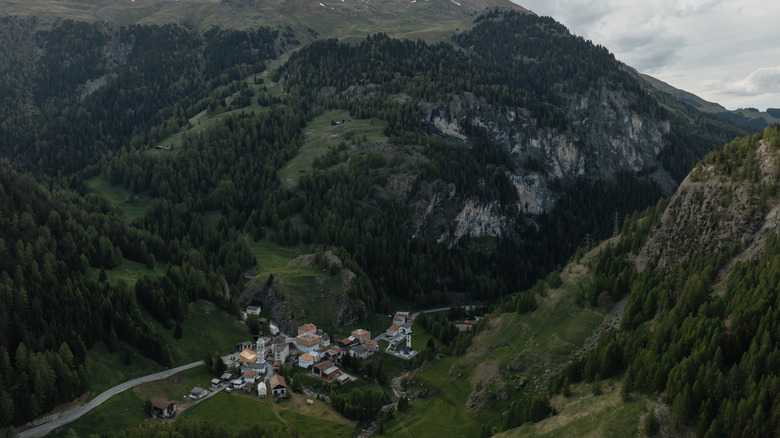 An aerial shot from on high of the town of Mulegns, deep in the Alpine mountains