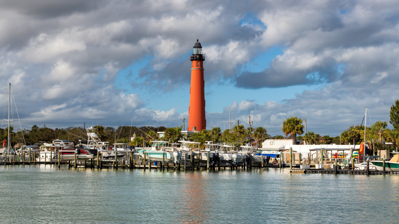 Lighthouse and palms at the harbor in Daytona Beach, Florida