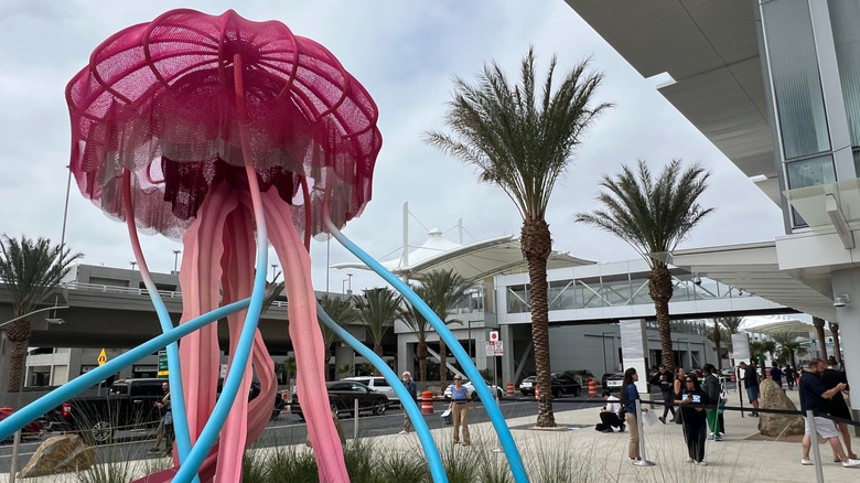 A view of a sculpture of a jellyfish and glass walls at San Diego Terminal 1