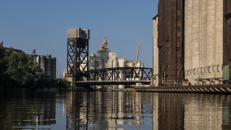 Silos, storage tower and bridge, reflected in the waters in Buffalo
